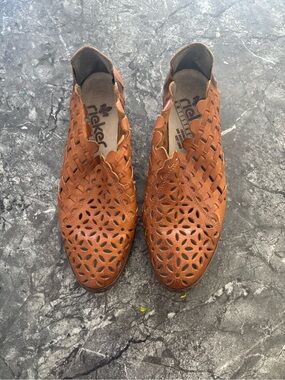 Rieker women’s Brown Laser-Cut Leather Slip-Ons